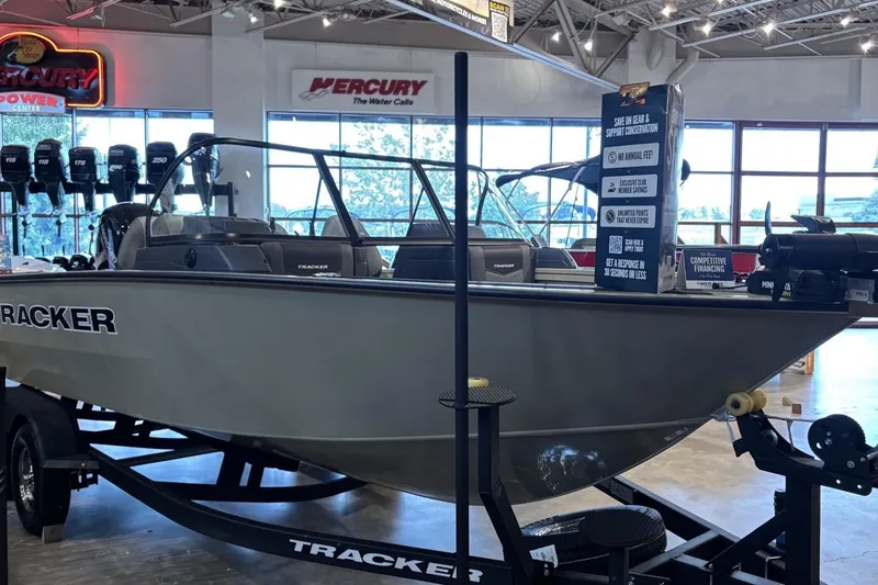 The Image of 2026 Tracker Targa V-19 WT boat displayed in showroom with Mercury signage. - 0