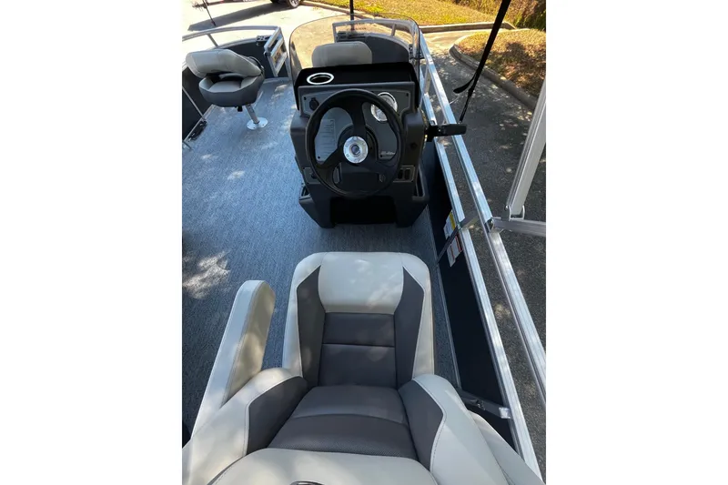 Slide: The Image of 2026 Sun Tracker Bass Buggy 16 XL Select interior with steering wheel and seating. - 5