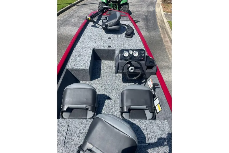 Slide: The Image of 2026 Tracker Pro 170 boat interior with steering console and seating. - 3