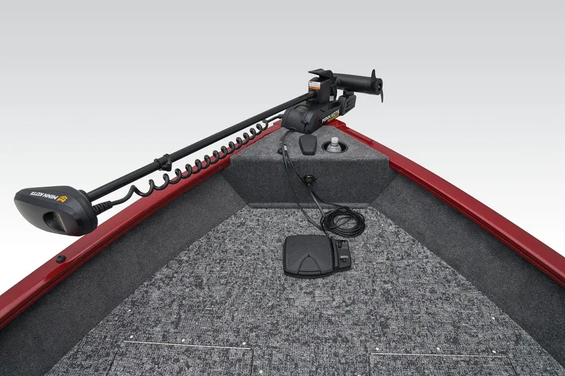 Slide: The Image of 2026 Tracker Pro Guide V-16 WT boat with canopy in a parking lot. - 9