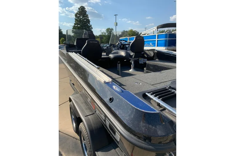 Slide: The Image of 2025 Nitro ZV20 boat with sleek design and comfortable seating on a sunny day. - 10