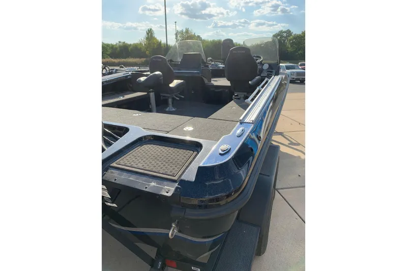 Slide: The Image of 2025 Nitro ZV20 boat with spacious deck and seating, under a clear sky. - 8