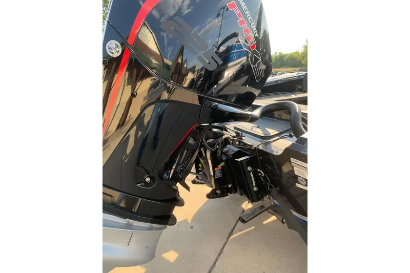 Slide: The Image of 2025 Nitro ZV20 boat with Mercury Pro XS engine, showcasing sleek black and red design. - 9