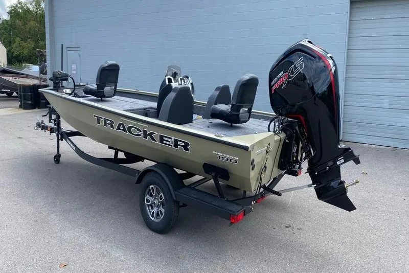 Slide: The Image of 2026 Tracker Pro Team 190 boat on trailer, featuring a powerful outboard motor. - 4