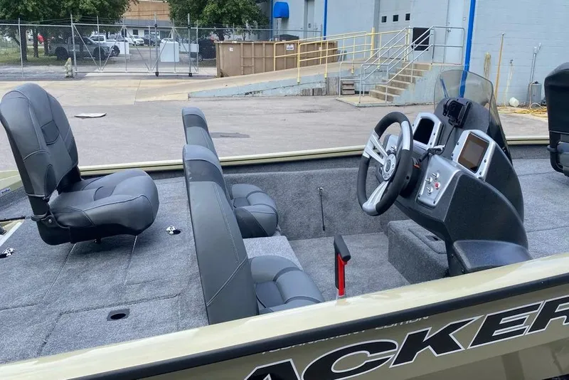 Slide: The Image of 2026 Tracker Pro Team 190 boat interior with steering console and seating. - 5