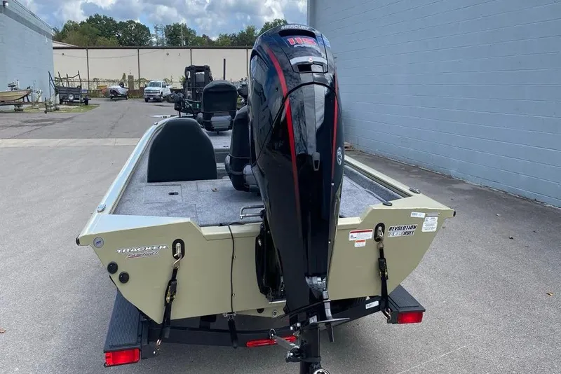 Slide: The Image of 2026 Tracker Pro Team 190 boat with Mercury outboard motor, parked outdoors. - 6