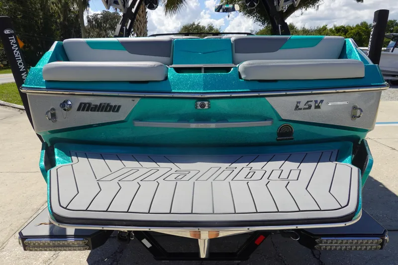 Slide: The Image of 2019 Malibu Wakesetter 23 LSV boat, teal and gray, rear view with logo. - 5