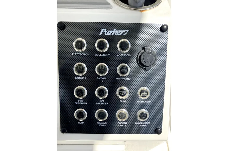 Slide: The Image of Control panel of 2024 Parker 2200 Center Console boat with labeled switches. - 11