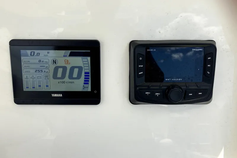 Slide: The Image of Yamaha display and Wet Sounds control panel on 2024 Parker 2200 Center Console boat. - 15