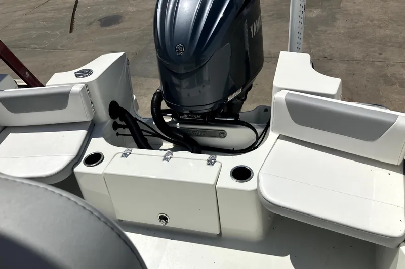 Slide: The Image of 2024 Parker 2200 Center Console boat with Yamaha engine, featuring seating and storage compartments. - 17