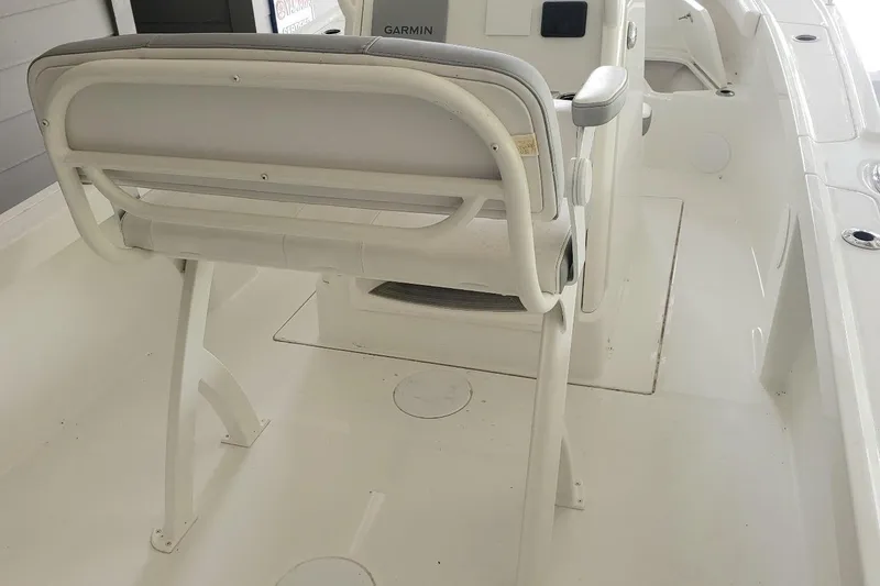 Slide: The Image of 2024 Parker 2200 Center Console boat interior with seating and console view. - 3