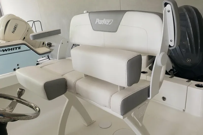 Slide: The Image of 2024 Parker 2200 Center Console boat interior with white and gray seating. - 5