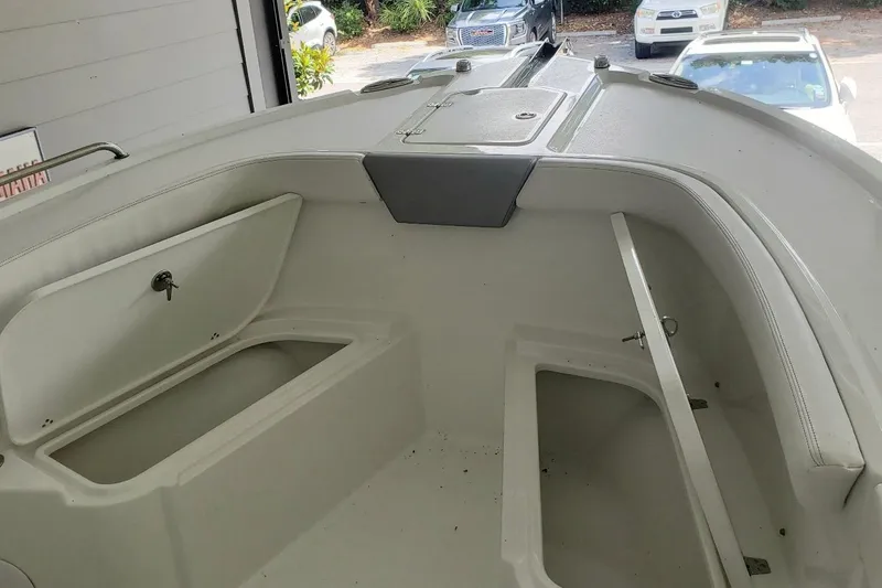 Slide: The Image of 2024 Parker 2200 Center Console boat interior with storage compartments and seating. - 9