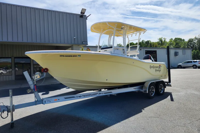 Slide: The Image of 2013 Sea Fox 226 Commander boat on trailer, parked outside a building. - 1