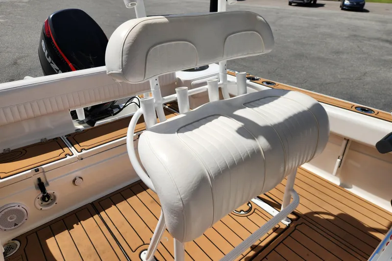 Slide: The Image of 2013 Sea Fox 226 Commander boat interior with white seating and teak flooring. - 13
