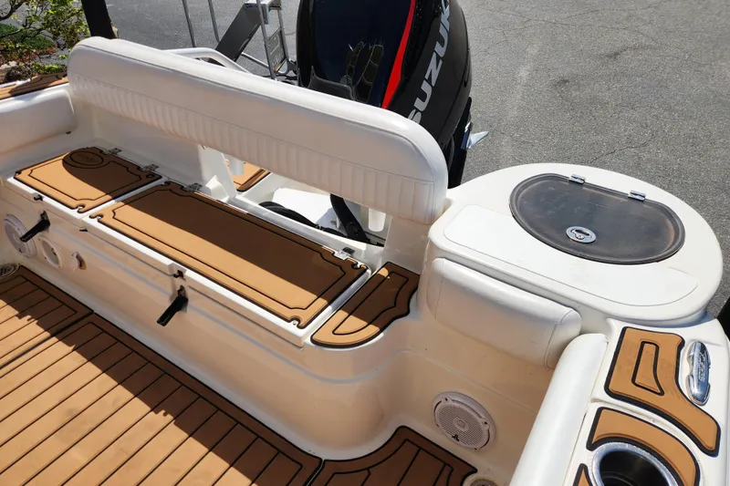 Slide: The Image of 2013 Sea Fox 226 Commander boat interior with seating and storage compartments. - 15