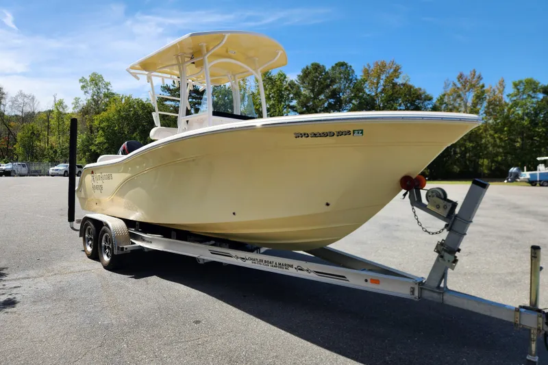 Slide: The Image of 2013 Sea Fox 226 Commander boat on trailer in sunny outdoor setting. - 7