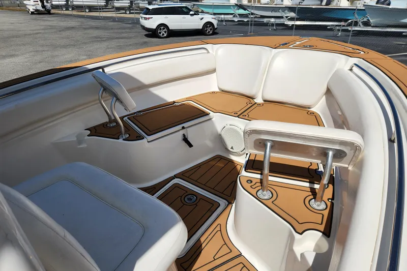 Slide: The Image of 2013 Sea Fox 226 Commander boat interior with tan and white seating and deck. - 8