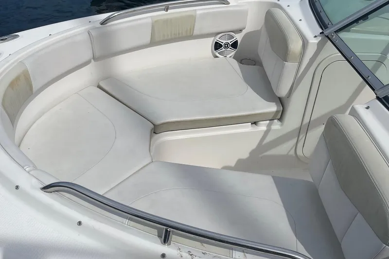 Slide: The Image of 2016 Robalo R227 Dual Console boat interior with cushioned seating and speaker. - 5
