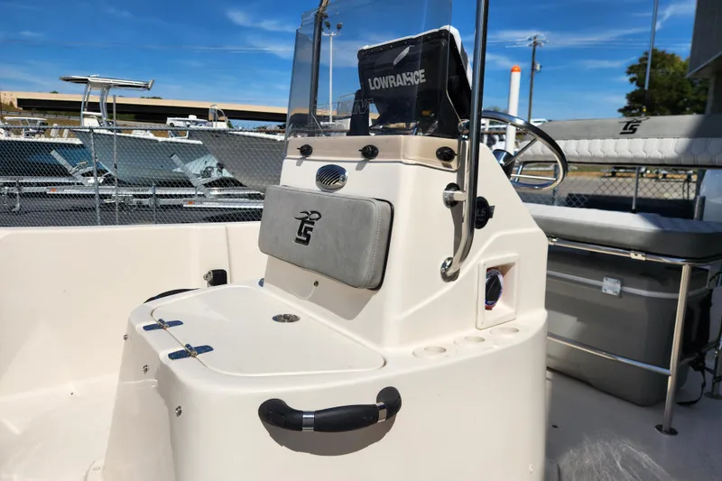 Slide: The Image of 2025 Carolina Skiff 178 JLS boat interior with steering console and seating. - 8