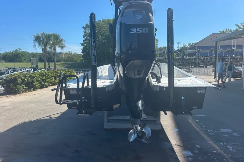 Slide: The Image of 2020 Dargel Kat 250 HDX boat with Suzuki 350 outboard motor, docked outdoors. - 10