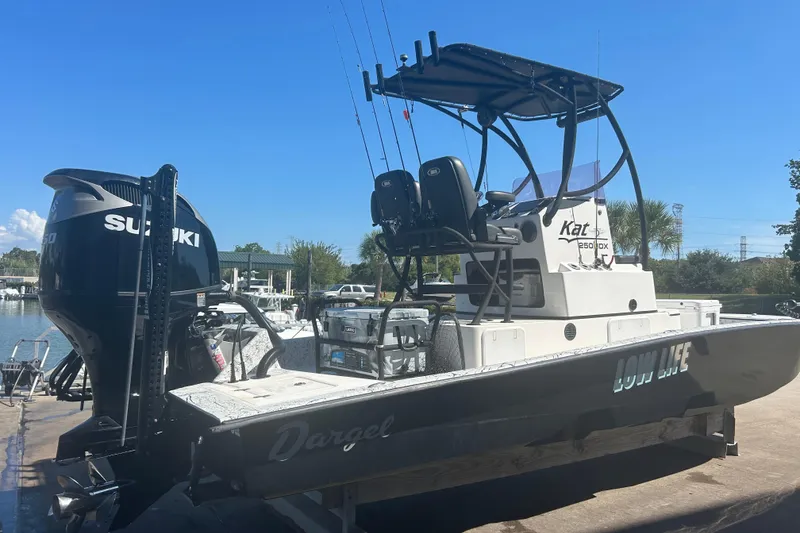 Slide: The Image of 2020 Dargel Kat 250 HDX boat with Suzuki engine, docked under clear blue sky. - 15