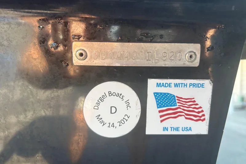 Slide: The Image of 2020 Dargel Kat 250 HDX boat identification plate with USA pride sticker. - 16