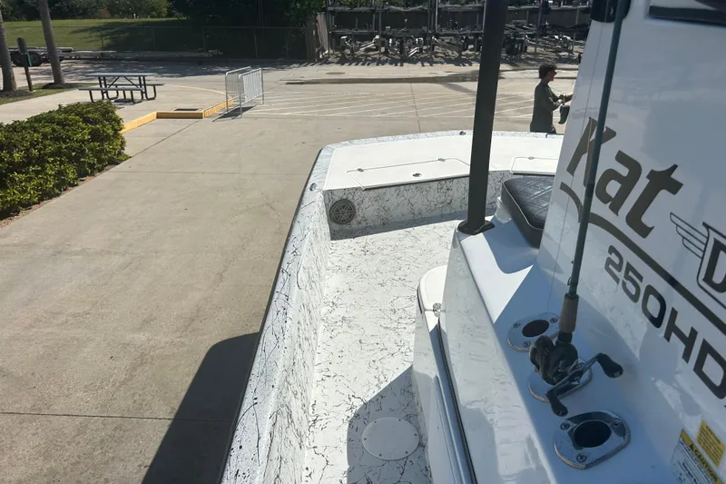 Slide: The Image of 2020 Dargel Kat 250 HDX boat parked on concrete, showcasing interior and branding. - 25