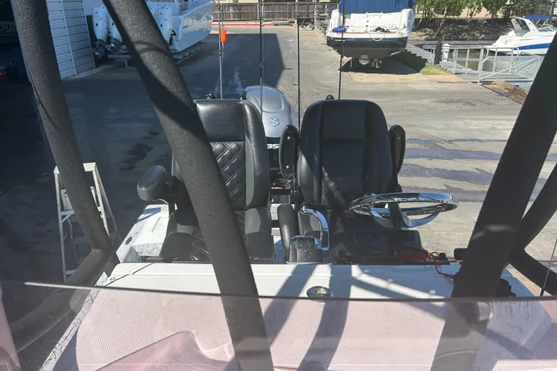 Slide: The Image of 2020 Dargel Kat 250 HDX boat interior with dual seats and steering wheel. - 31