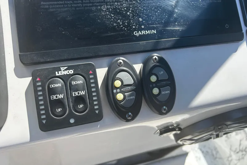 Slide: The Image of Control panel of a 2020 Dargel Kat 250 HDX boat with Lenco and Garmin systems. - 35