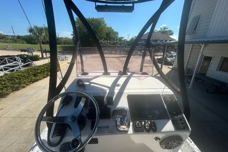 Slide: The Image of 2020 Dargel Kat 250 HDX boat console with steering wheel and navigation controls. - 36