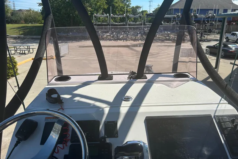 Slide: The Image of 2020 Dargel Kat 250 HDX boat dashboard with steering wheel and controls. - 37