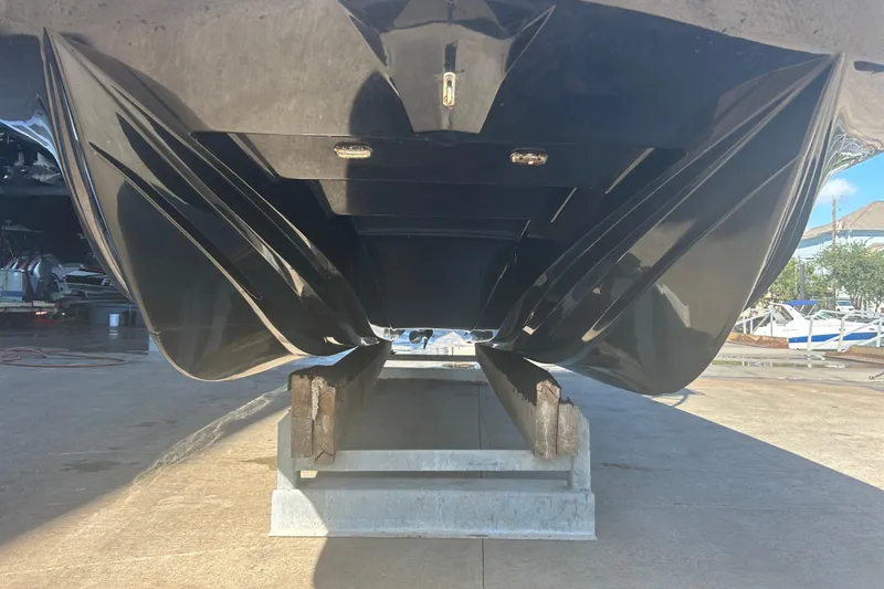 Slide: The Image of 2020 Dargel Kat 250 HDX boat hull on a trailer, viewed from below. - 4