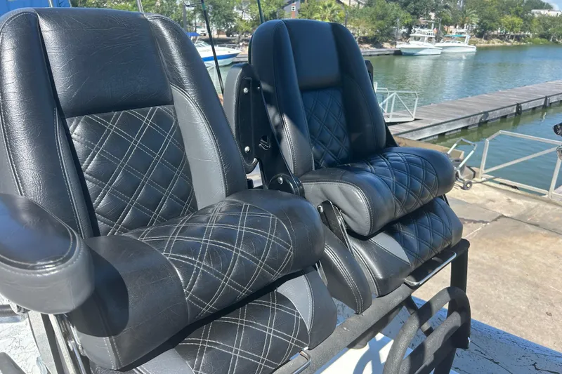 Slide: The Image of Luxurious black leather seats on a 2020 Dargel Kat 250 HDX boat by the water. - 41