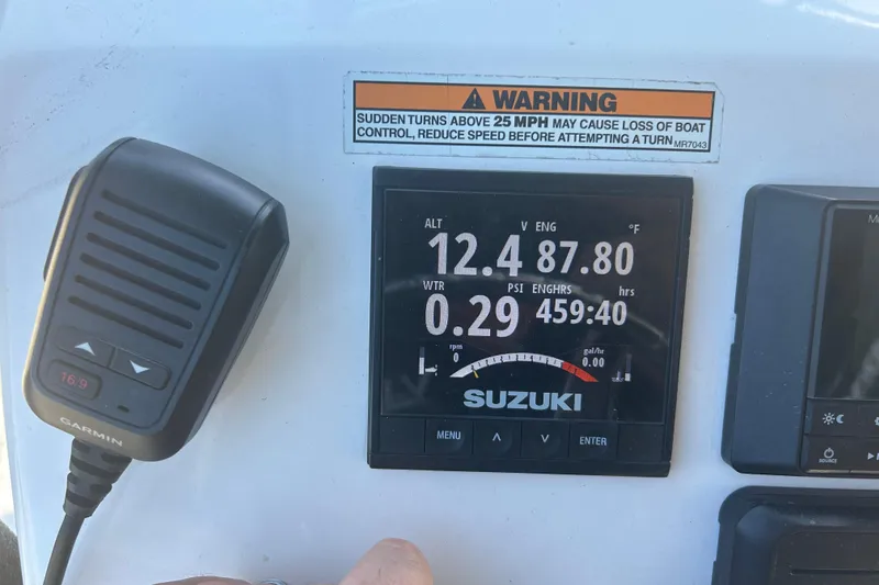 Slide: The Image of Control panel of 2020 Dargel Kat 250 HDX boat with Suzuki display and Garmin device. - 42