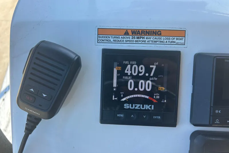 Slide: The Image of Control panel of a 2020 Dargel Kat 250 HDX boat with Suzuki display and Garmin device. - 43