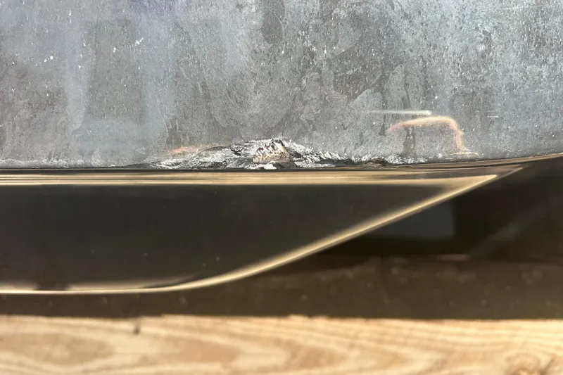 Slide: The Image of Damaged hull of 2020 Dargel Kat 250 HDX boat, showing wear and tear. - 45