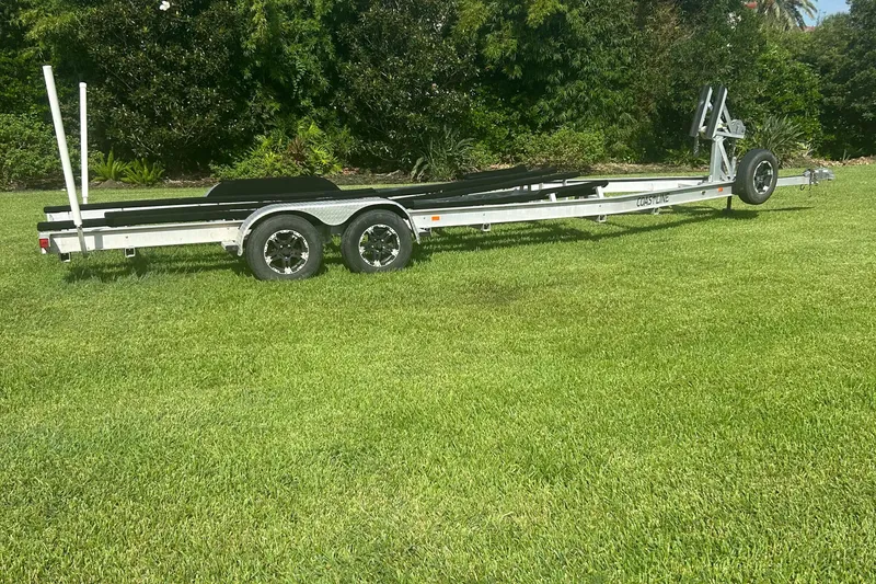 Slide: The Image of 2020 Dargel Kat 250 HDX boat trailer on grass, surrounded by lush greenery. - 51