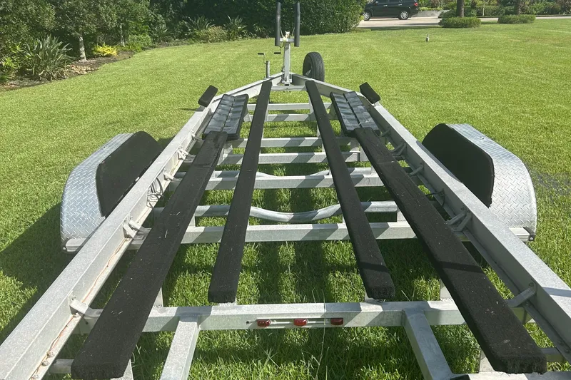 Slide: The Image of Boat trailer for 2020 Dargel Kat 250 HDX on grass, ready for transport. - 59