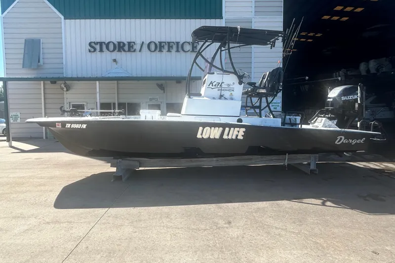 Slide: The Image of 2020 Dargel Kat 250 HDX boat named "Low Life" outside store/office. - 6