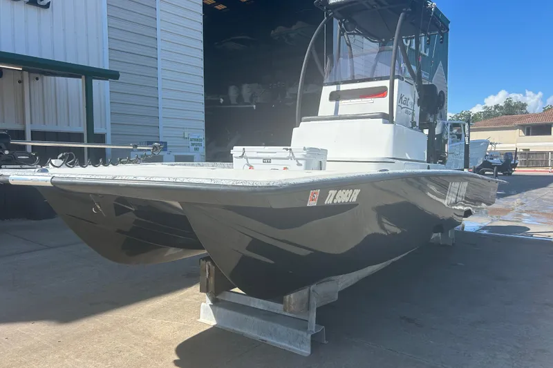 Slide: The Image of 2020 Dargel Kat 250 HDX boat on display at a marina. - 7