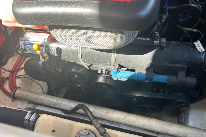 Slide: The Image of Engine compartment of a 2008 Chaparral 275 SSi boat, showing mechanical components. - 12