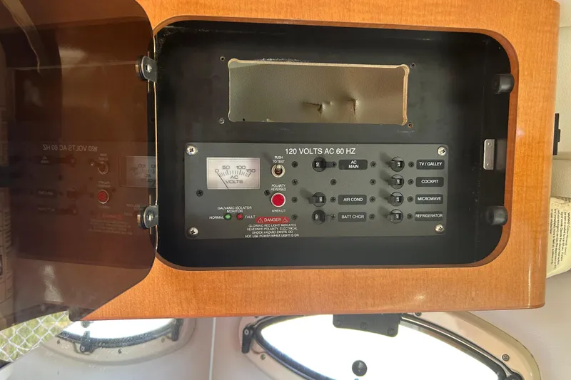 Slide: The Image of Electrical panel of a 2008 Chaparral 275 SSi boat, featuring various controls and indicators. - 15