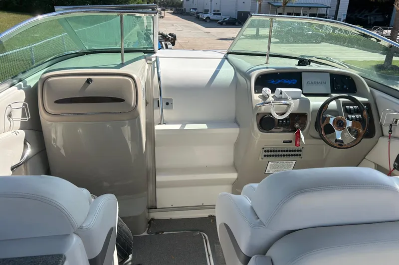 Slide: The Image of 2008 Chaparral 275 SSi boat interior with steering wheel and Garmin navigation system. - 16
