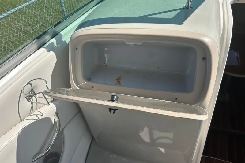 Slide: The Image of Open storage compartment in 2008 Chaparral 275 SSi boat interior. - 21