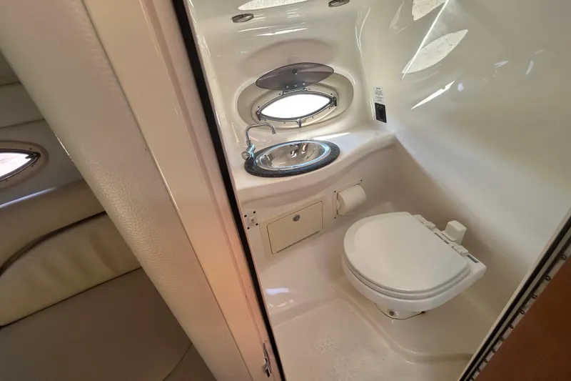 Slide: The Image of 2008 Chaparral 275 SSi boat bathroom with sink and toilet. - 23