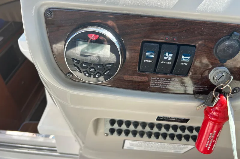 Slide: The Image of Control panel of 2008 Chaparral 275 SSi boat with stereo, blower, and horn switches. - 28