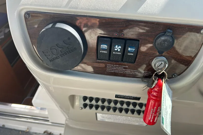 Slide: The Image of Control panel of a 2008 Chaparral 275 SSi boat with keys and switches. - 29