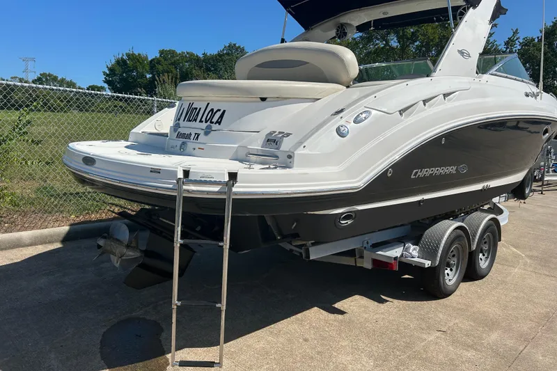 Slide: The Image of 2008 Chaparral 275 SSi boat on trailer, rear view, with ladder and "La Vida Loca" text. - 3
