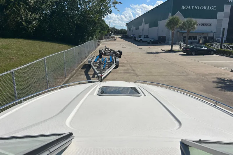 Slide: The Image of 2008 Chaparral 275 SSi boat at storage facility, view from bow, sunny day. - 31